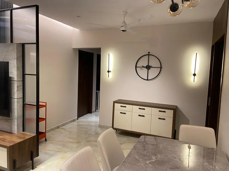 Contemporary dining area with marble table, sideboard and accent trolley.